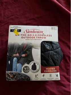 Heated cordless throw