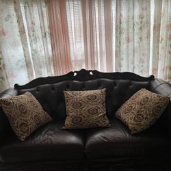 Leather Couch ( Space for 3-4 People)