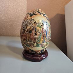 Asian ceramic egg  with stand
