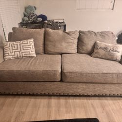 Beige Couch With 2 Decor Pillows