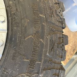 Dick Cepek 15 Inch Tire taking off a jeep