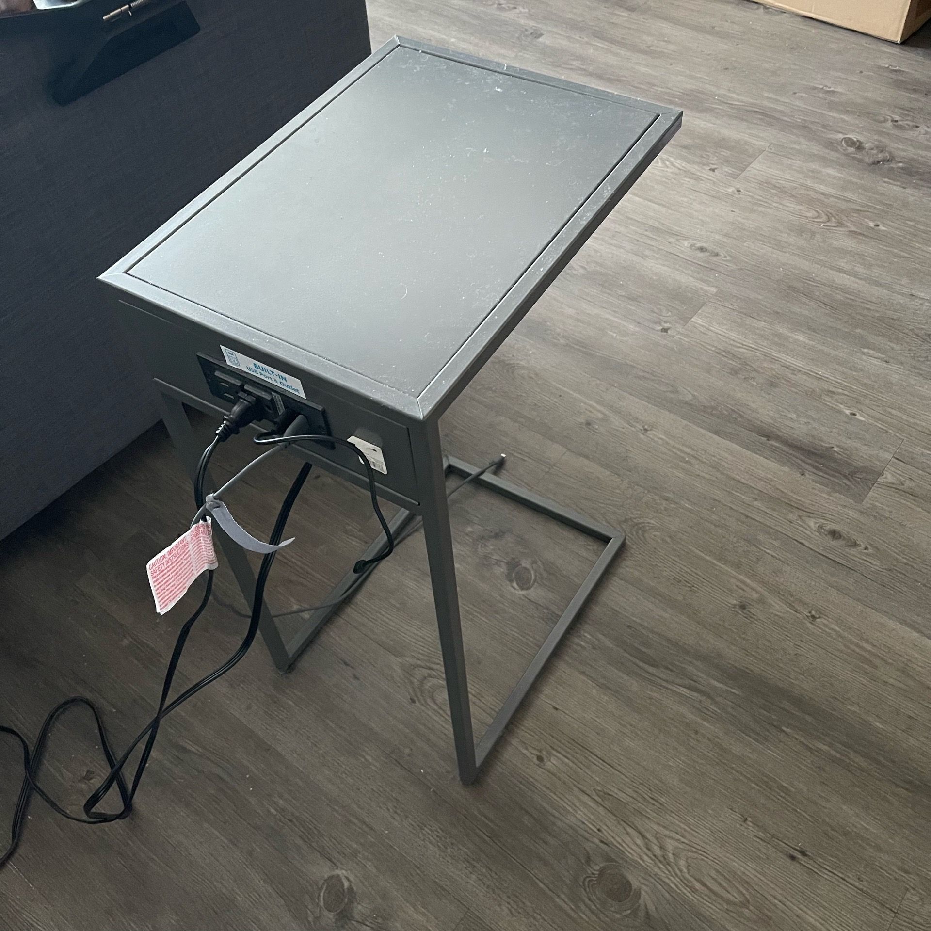 C shaped side table with charging station