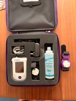 Exogen Portable Ultrasound Therapy Device with Purple Case and extra strap