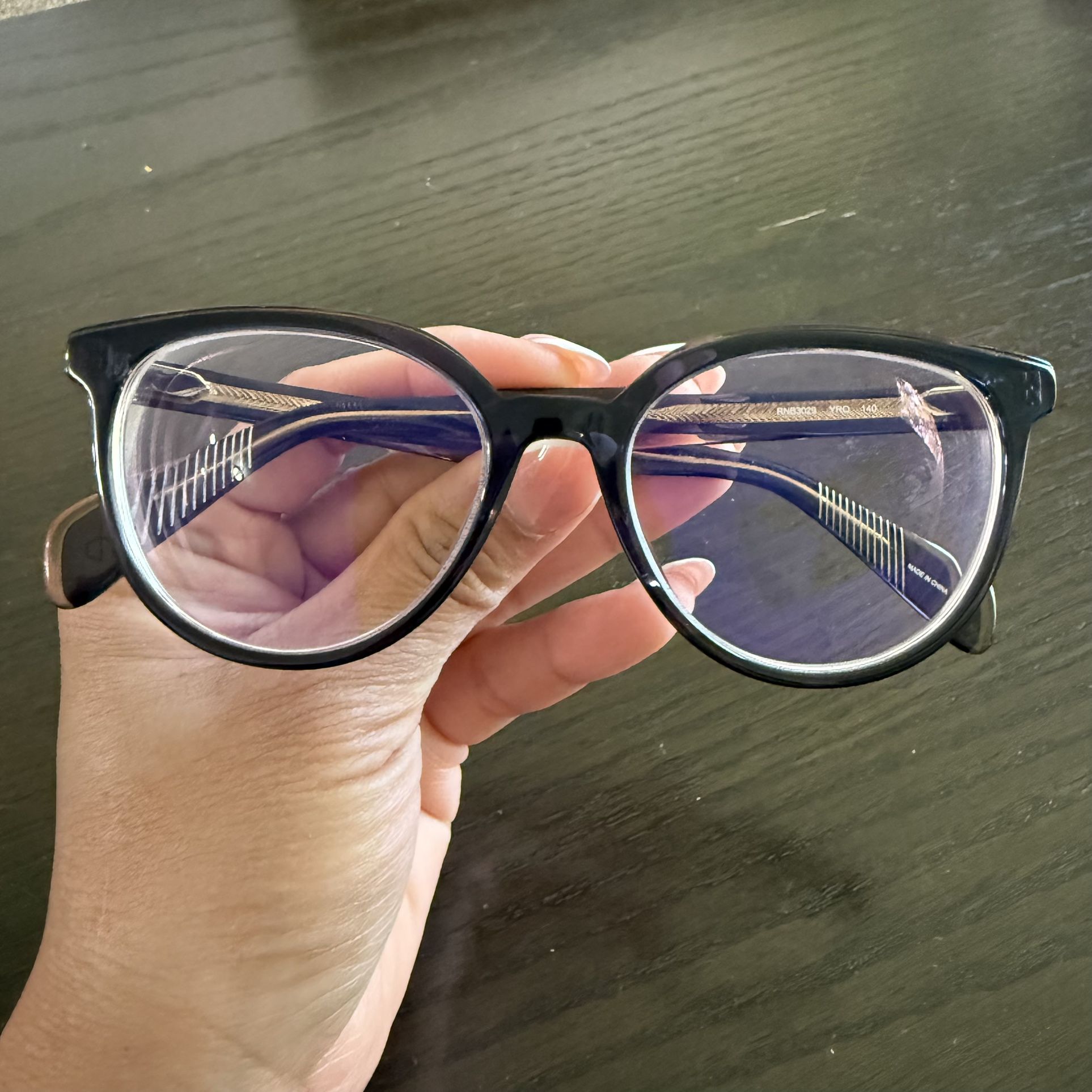 Rag & Bone eyeglasses with a black frame RNB3029 YRQ 140