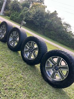Set of 4 Ford F-150 Wheels with Nitto Terra Grappler G2 Tires