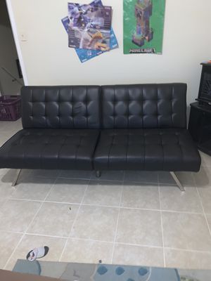 Photo I really need to sell this ASAP my price is $90 leather futon it’s in perfect condition there’s even a zipper underneath where you can put stuff unde