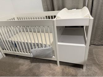 Crib + changing table + storage drawer + mattress