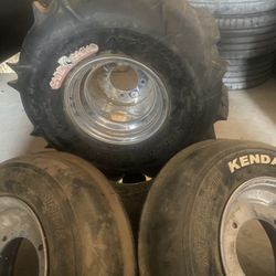 ATV SET OF WHEELS AND ALUMINUM RIMS