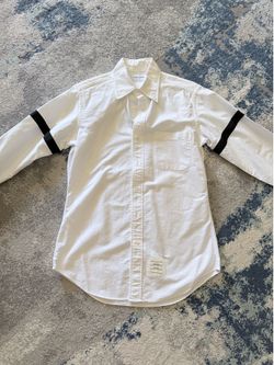 Thom Browne men shirt size 2 like size M Purchased at south coast mall original price was $650 before tax. Let me know if you need details photos