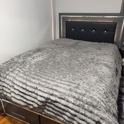 Queen-sized bed frame with storage drawers