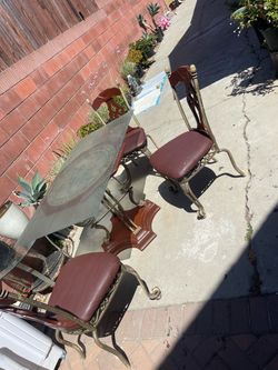Glass table with three chairs
