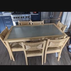 Glass Top Table And 6 Woven Chairs