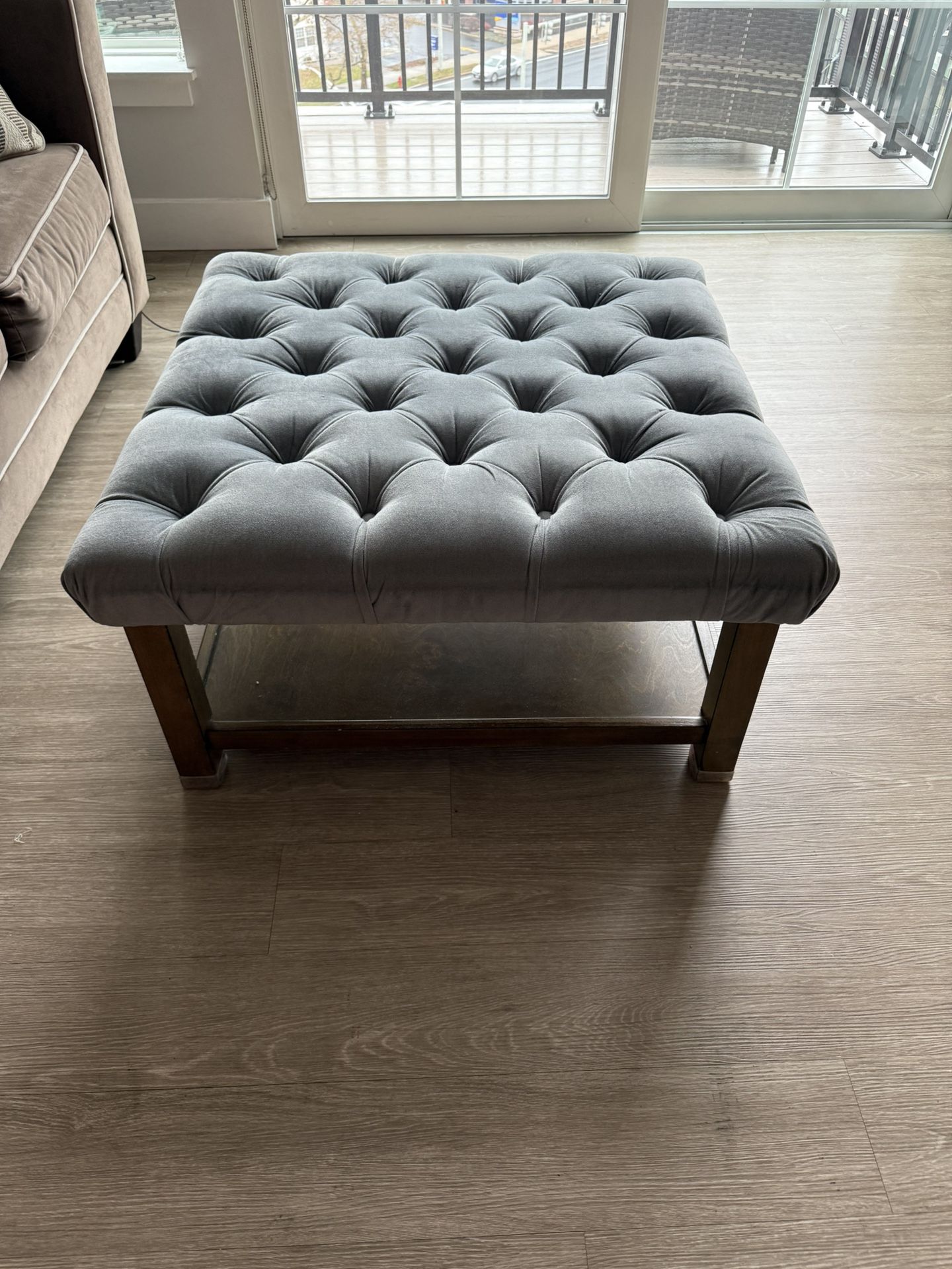 Coffee table with cushion top and storage