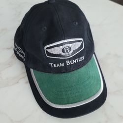 A RARE VINTAGE BLACK  AND GREEN TEAM BENTLEY MOTORSPORT BASEBALL CAP