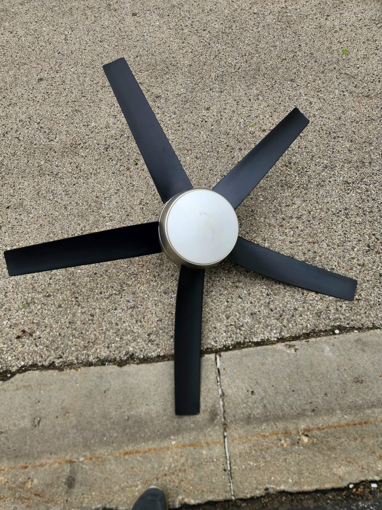 Brown ceiling fan with remote control.