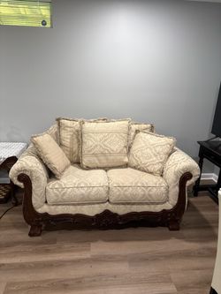 Traditional Carved Wood Loveseat with Damask Upholstery