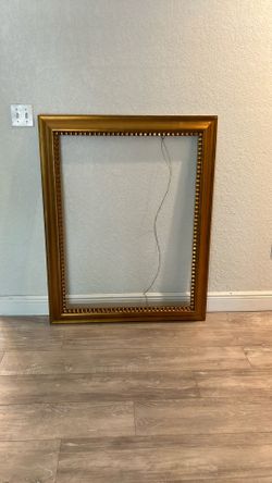 Oversize, large gold picture frame with glass