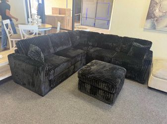 Black corduroy sectional with ottoman