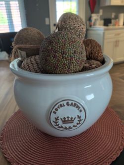 White ceramic bowl with decorative balls