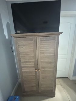 Tall cabinet with tv