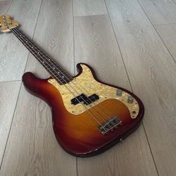 1994 Fender Japan Foto Flame Precision Bass Amber burst. 