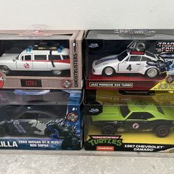 1:32 diecast cars.  Ecto-1, GTR, Transformer Porsche, TMNT Camaro