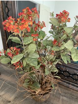 Artificial flowers in a ceramic pot