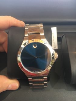 2 brand new Movados blue and black face