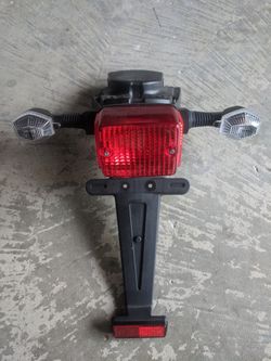 OEM DRZ400sm tail light .... COMPLETE WITH SIGNAL LIGHTS