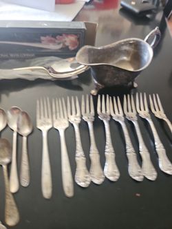Silver spoons and small forks all for $95