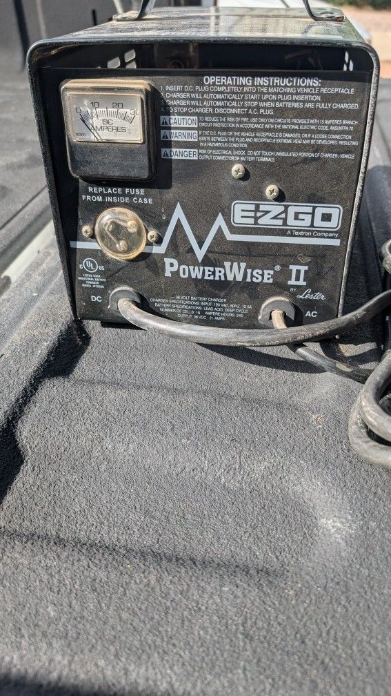 Power wise 36volt charer, DC ammeter gauge and a fuse replacement notice. The charger is labeled '36 Volt Battery Charger'