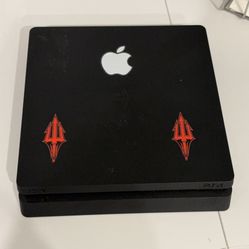 Black PS4 Console with Apple Logo Sticker