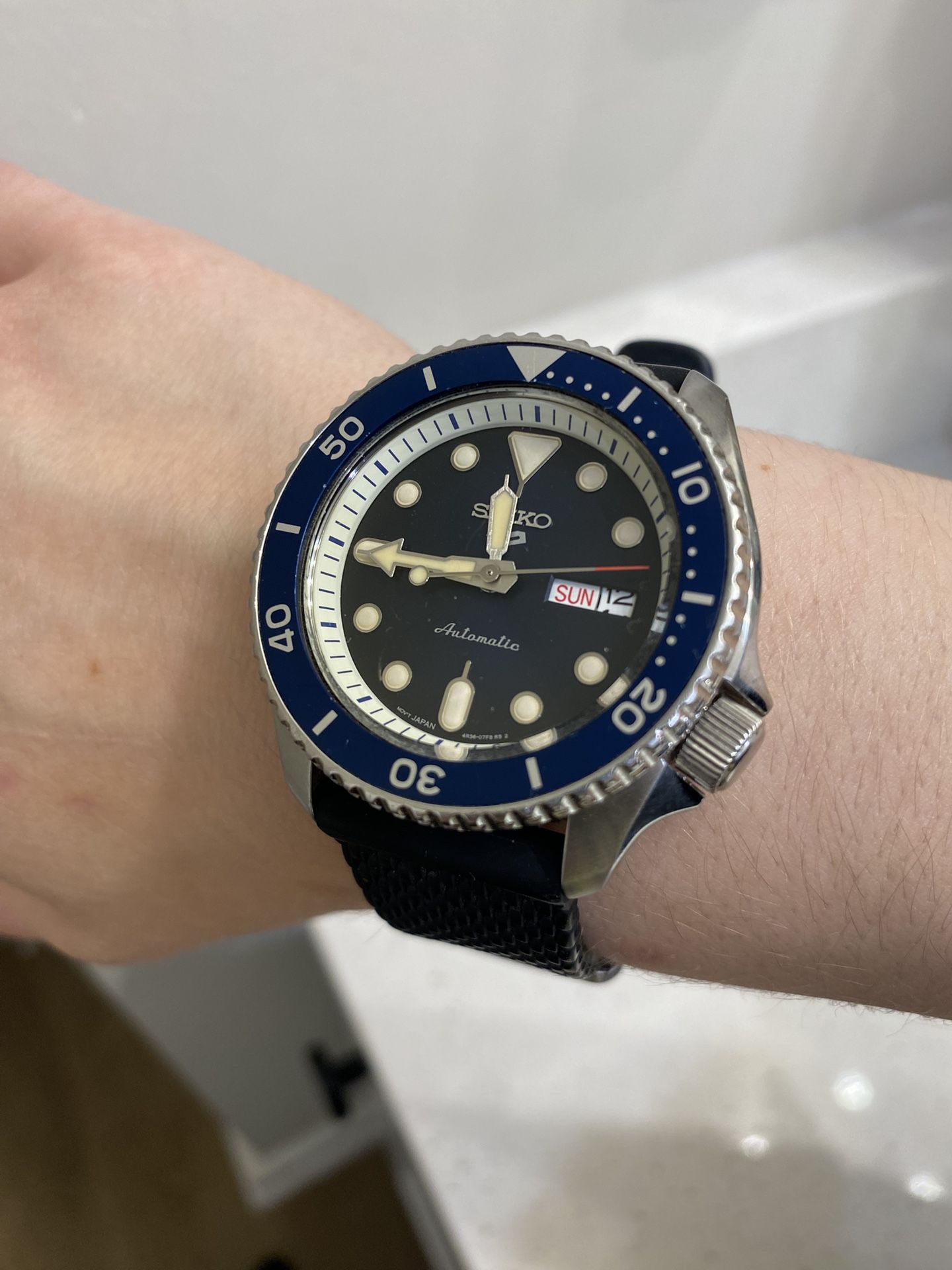Seiko SRPD20 watch with blue bezel and black strap #SeikoSRPD20