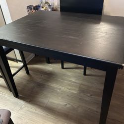 Black Wooden Table With 4 Gray Chairs