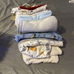 A bunch of baby blankets + muslin blankets
