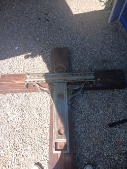 handmade wooden wall cross dark stain, with metal design. Full size adult male.