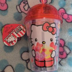 hello kitty tumbler with lollipops. 