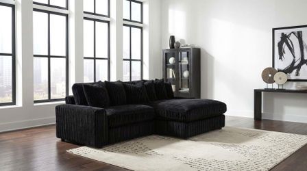 New sectional black corduroy