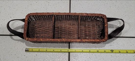 Dark brown woven wicker 3-compartment storage caddy featuring looped side handles and an open rectangular design.