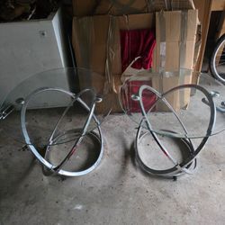 two end tables. Glass and Silver