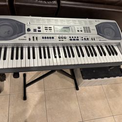 Casio 61 Key Electronic Key Lighting System Keyboard with Stand and AC Power Adapter Model: LK-90TV