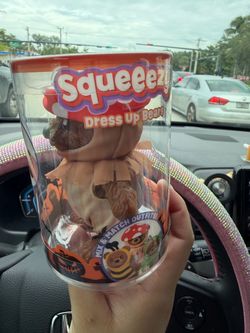 Squeezy dress up bear