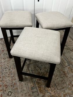 3 wood and cloth stools