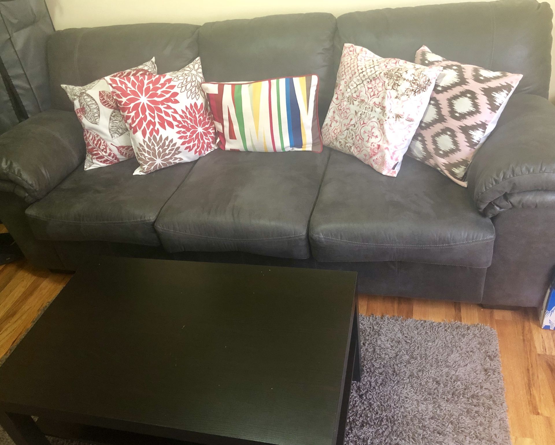 Signature design by Ashley Benton Sofa. Lack coffee table, rug and cushions included