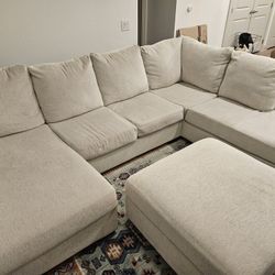 Sectional Sofa In Cream With Chaise And Storage Ottoman
