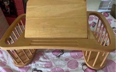 A wooden table Good Condition. Just missing one stick.