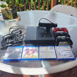 PS4 console with 3 controllers, 4 games, camera, guitar USB cable for Rocksmith, earpiece set/mic
