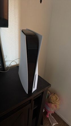 ps5 with two controllers and three games