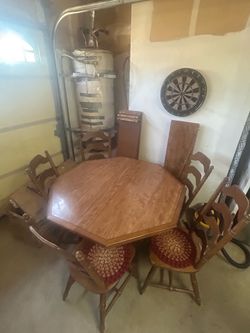 Solid maple dinning table with 4 leaves and hutch