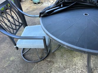 Outdoor patio table 48” and 2 swivel chairs. Excellent Condition. Kept under cover. 2 additional chairs available for an additional $75 each